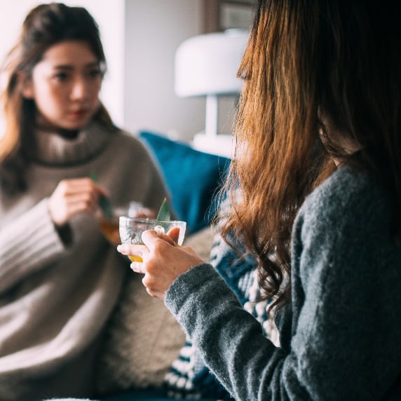 Friends drinking coffee talking